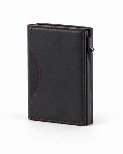 Schwarzes CARRYON X MagCardShield Kartenetui auf warmweißem Hintergrund.